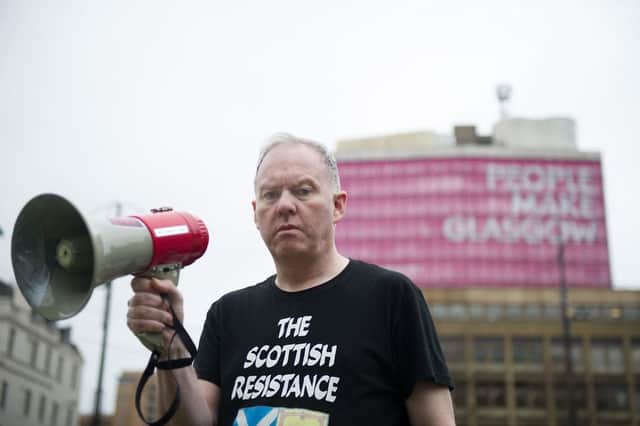Sean Clerkin, in his familiar Scottish Resistance tshirt, during a protest at George Square in Glasgow. Picture: John Devlin