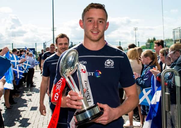 Scott Wight with the Twickenham 7s trophy as the squad returned to Murrayfield. Picture: Ross Parker/SNS/SRU