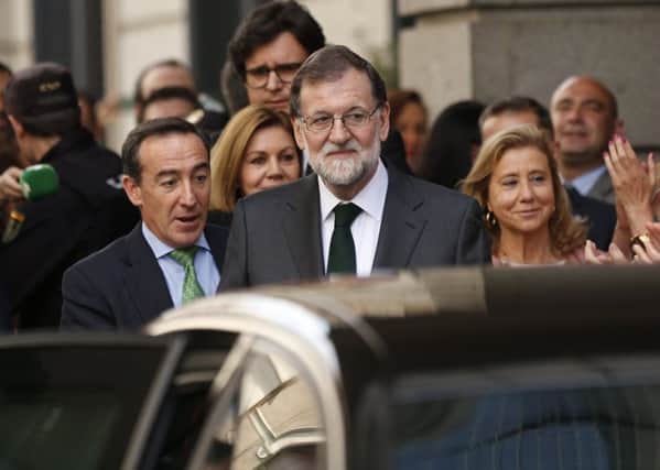 Spain's Prime Minister Mariano Rajoy leaves the parliament after a motion of no confidence vote at the Spanish parliament in Madrid. Picture: AP