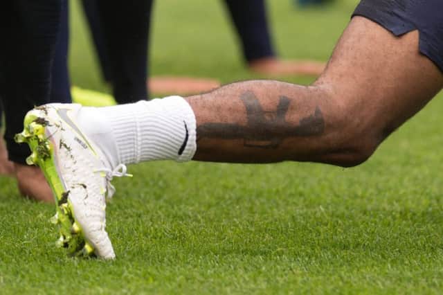 Tabloids were outraged over Raheem Sterlings gun tattoo  in contrast to their adoration of Becks ink.  Photograph: Oli Scarff/Getty