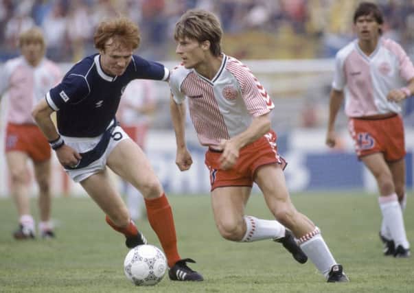 Alex McLeish battles with Denmark striker Michael Laudrup during Scotlands opening game of the 1986 World Cup finals in Mexico. Picture: Getty.