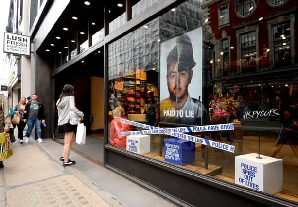 A Lush store on Oxford Street, London, displays a poster criticising undercover policing. (Picture: PA)