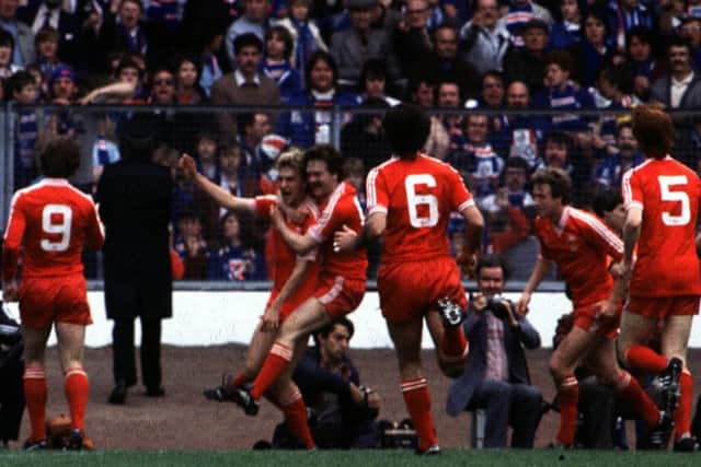 The late
Neale Cooper is congratulated by his team mates after scoring for Aberdeen in the 1982 Scottish Cup final win over Rangers. Picture: SNS