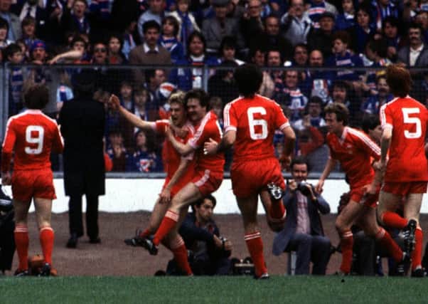 The late 
Neale Cooper is congratulated by his team mates after scoring for Aberdeen in the 1982 Scottish Cup final win over Rangers. Picture: SNS