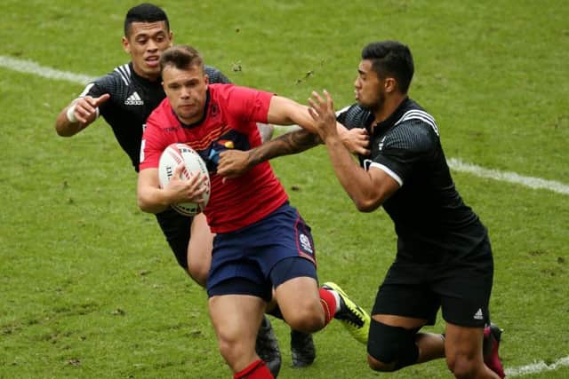 Scotlands Gavin Lowe is tackled by New Zealands Etene Nanai-Seturo in their 12-24 defeat.  Photograph: Paul Harding/PA