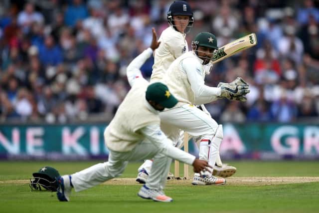 Dominic Bess guides the ball past wicketkeeper Sarfraz Ahmed and Asad Shafiq. Photograph: Gareth Copley/Getty