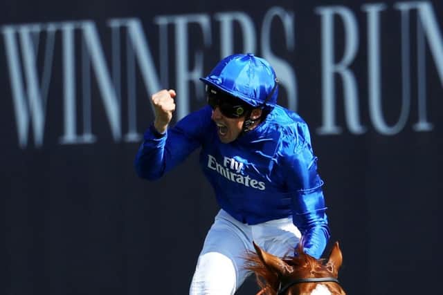 William Buick celebrates crossing the line on Masar in the Derby. Picture: Warren Little/Getty.