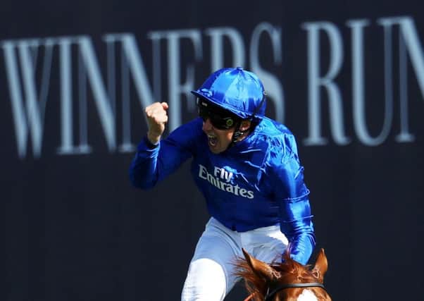 William Buick celebrates crossing the line on Masar in the Derby. Picture: Warren Little/Getty.