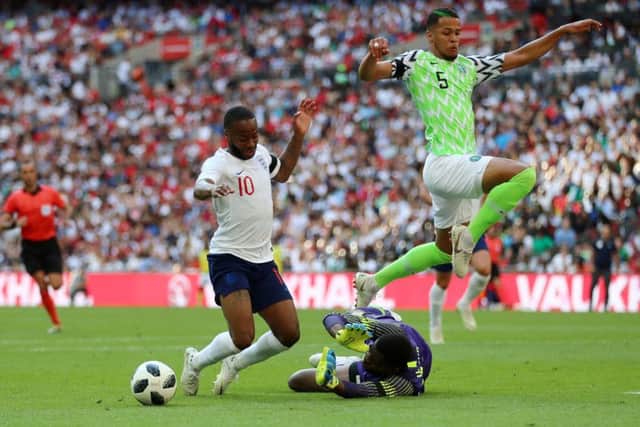 Raheem Sterling goes down inside the Nigeria penalty box, a dive which earned the England attacker a booking.  Photograph: Tim Goode/PA