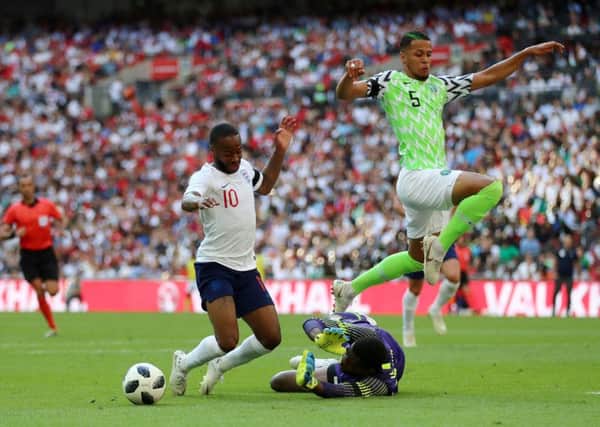 Raheem Sterling goes down inside the Nigeria penalty box, a dive which earned the England attacker a booking.  Photograph: Tim Goode/PA