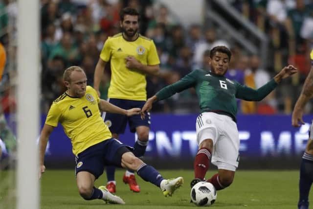 Mexico's Jonathan dos Santos and Scotland's Dylan McGeouch compete in the weekend's friendly. Picture: AP