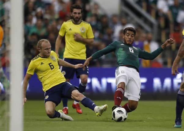Mexico's Jonathan dos Santos and Scotland's Dylan McGeouch compete in the weekend's friendly. Picture: AP