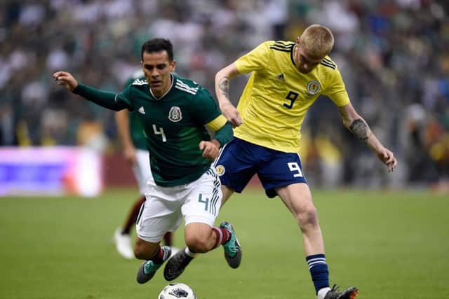 Mexico's Rafael Marquez and Scotland's Oliver McBurnie vie for the ball during their international friendly football match at the Azteca stadium. Picture; Getty