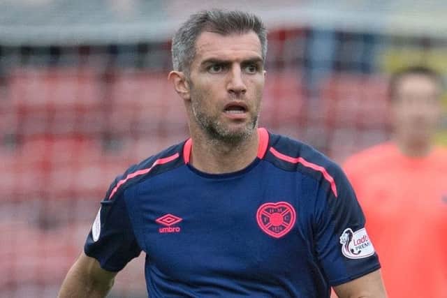 Aaron Hughes is still weighing up his future