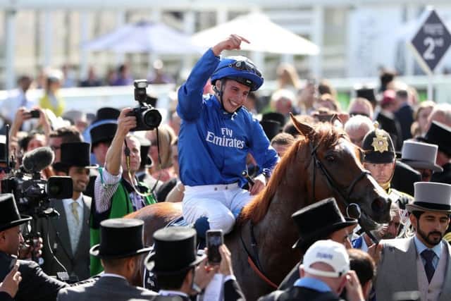 Winning jockey William Buick acknowledges Masar after the 16-1 shots impressive victory. Picture: PA.