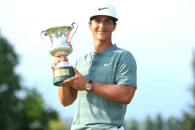 Thorbjorn Olesen beams after landing the Italian Open trophy at Gardagolf yesterday. Picture: Getty.