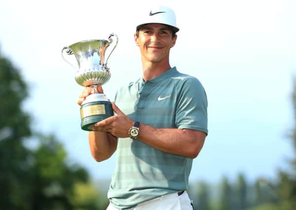 Thorbjorn Olesen beams after landing the Italian Open trophy at Gardagolf yesterday. Picture: Getty.