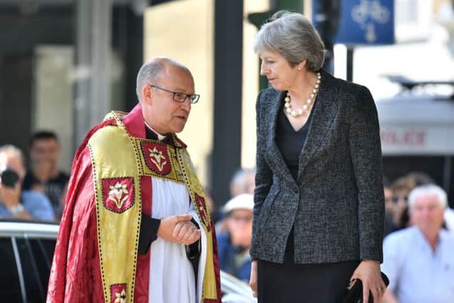 Prime Minister Theresa May speaks to Dean of Southwark Andrew Nunn, Picture: Dominic Lipinski/PA Wire