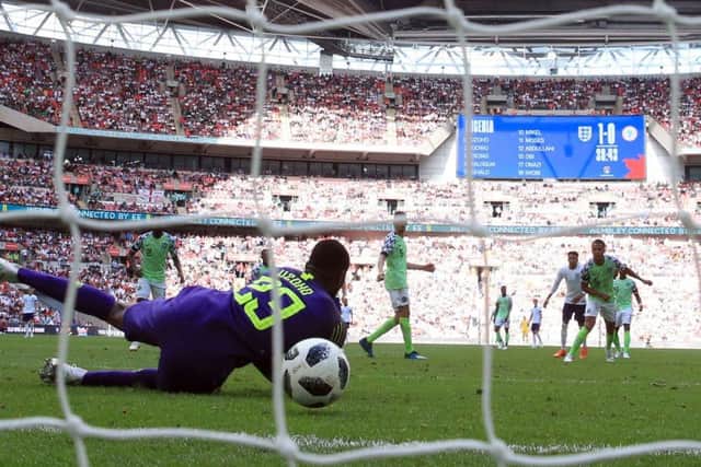 Harry Kane's effort squirms through the arms of Nigeria goalkeeper Francis Uzoho to put England 2-0 up at Wembley. Picture: PA.
