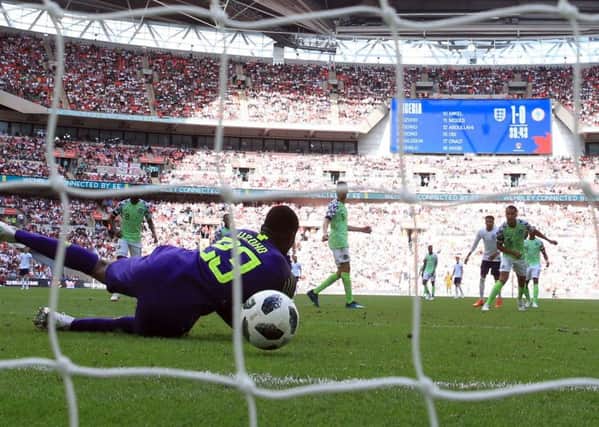 Harry Kane's effort squirms through the arms of Nigeria goalkeeper Francis Uzoho to put England 2-0 up at Wembley. Picture: PA.