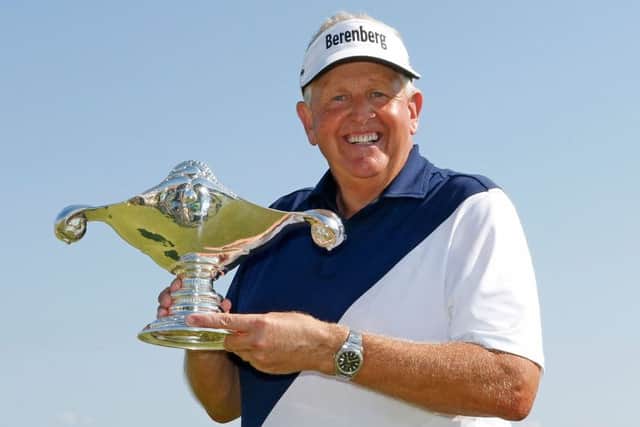 Colin Montgomerie shows off his Shipco Masters trophy after his victory in Denmark. Picture: Getty.