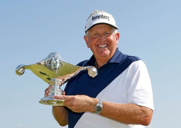 Colin Montgomerie shows off his Shipco Masters trophy after his victory in Denmark. Picture: Getty.