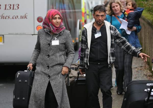 Syrian refugee families arrive at their new homes on the Isle of Bute in 2015. Picture: Christopher Furlong/Getty Images