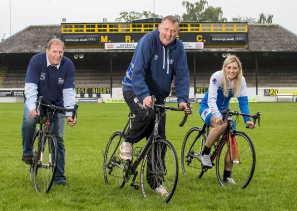 Doddie Weir is flanked by former rugby rival Peter Winterbottom and Scottish paralympic tandem cyclist Louise Haston at the Greenyards. Picture: Craig Watson