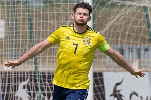 Scotland's forward and captain Oliver Burke celebrates after netting a spectacular solo goal against South Korea. Picture: AFP/Getty