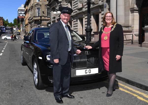 Glasgow Lord Provost Eva Bolander accepts the Rolls-Royce Ghost outside the City Chambers. The vehicle was gifted to the local authority by an unnamed donor.