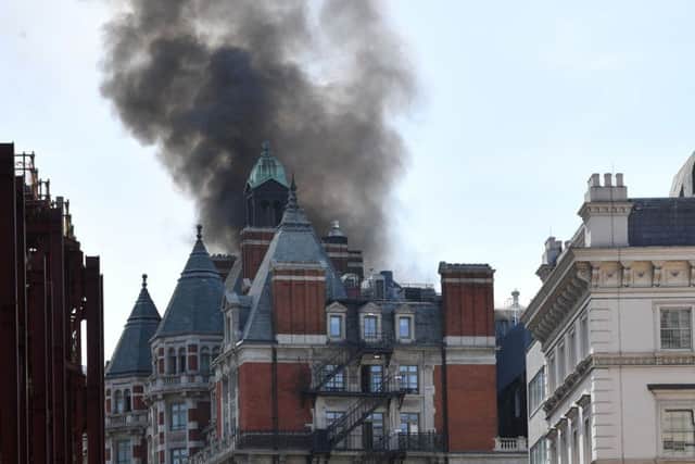 Smoke rising from a building in Knightsbridge, central London. Picture: John Stillwell/PA Wire
