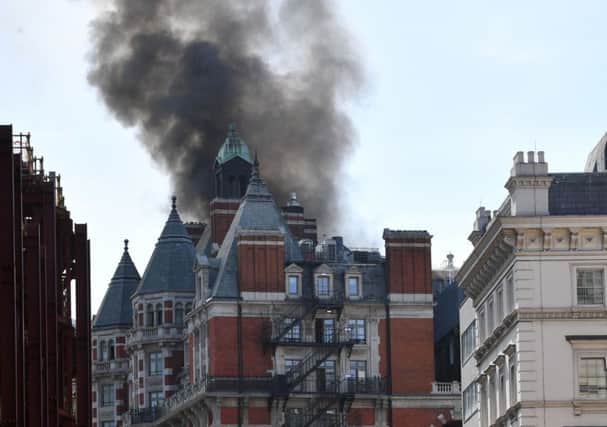 Smoke rising from a building in Knightsbridge, central London. Picture: John Stillwell/PA Wire
