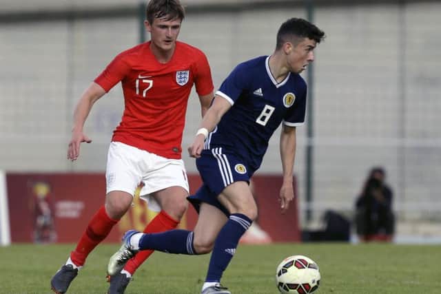 Michael Johnston in action during the semi-final clash with England at the Toulon Tournament. Picture: AP Photo/Claude Paris