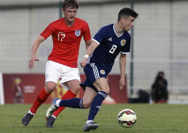 Michael Johnston in action during the semi-final clash with England at the Toulon Tournament. Picture: AP Photo/Claude Paris