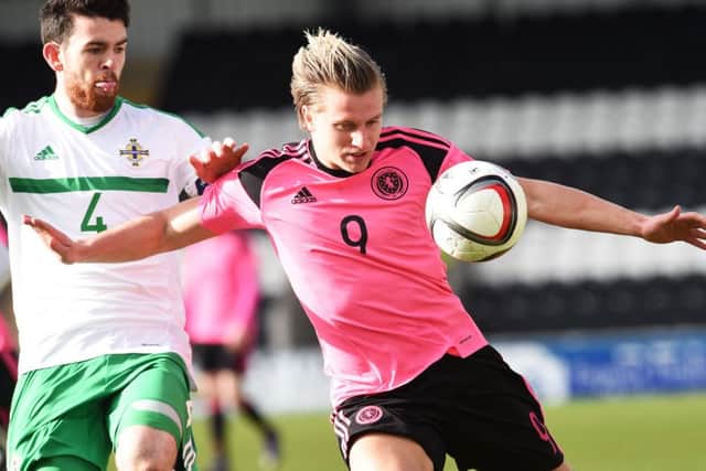 Motherwell's new signing Liam Donnelly challenges Jason Cummings. Picture: SNS/Bill Murray