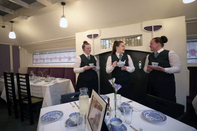 New waiters, from left, Chloe Smythe, Chloe Foley and Emma Jane Ferguson on their first day at the upgraded restaurant. Picture: Jane Barlow/PA