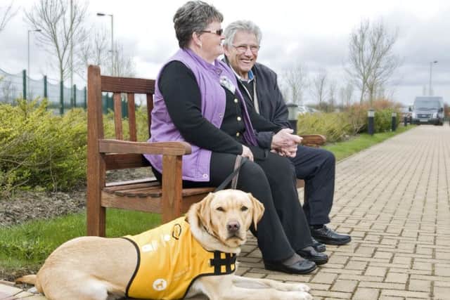 Glenys and Ken Will with their dementia dog Kaspa.