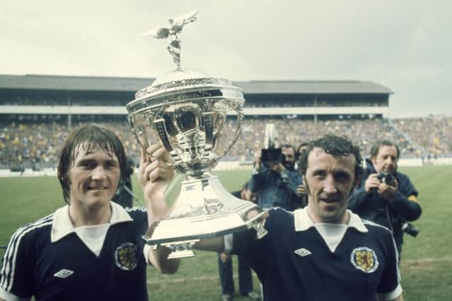 Kenny Dalglish and Danny McGrain with the trophy after beating England 2-1 to win the British Home Championship in 1976. Picture: Getty.