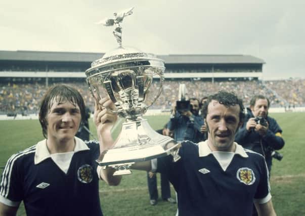 Kenny Dalglish and Danny McGrain with the trophy after beating England 2-1 to win the British Home Championship in 1976. Picture: Getty.