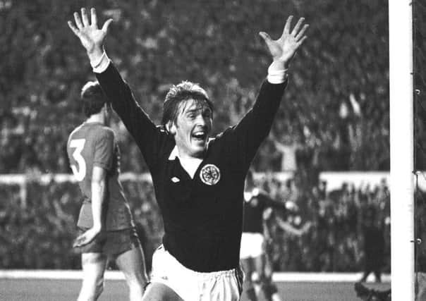 Kenny Dalglish celebrates his goal in the World Cup qualifier against Wales at Anfield in 1977 which sent Scotland to the finals. Picture: SNS.