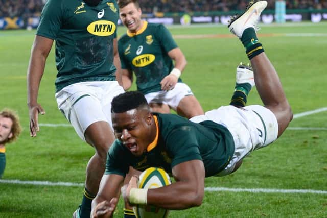 South African winger Aphiwe Dyantyi dives over during a thrilling Test match in Johannesburg. Photograph: Getty Images