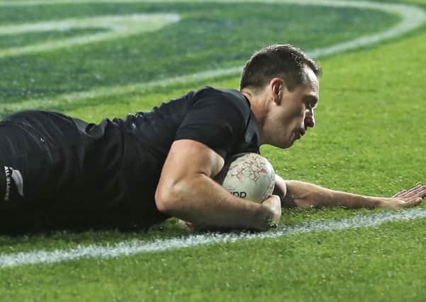 Ben Smith of New Zealand touches down during their victory over France in Auckland. Picture: AP.