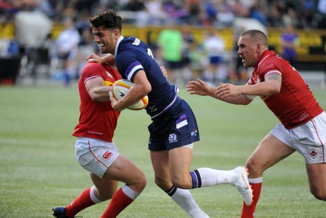 Adam Hastings bursts past two tackles during his debut in Edmonton. Picture: David Gibson/Fotosport