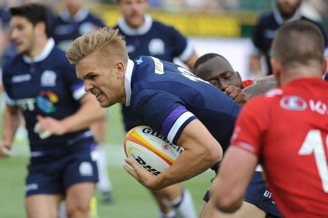 Chris Harris, selected at outside centre, breaks through the weak Canada defence. Pict ure: David Gibson/Fotosport.