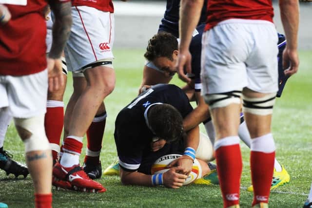 Hooker George Turner is congratulated by Ruaridh Jackson after touching down one of his three tries. Picture: David Gibson/Fotosport.