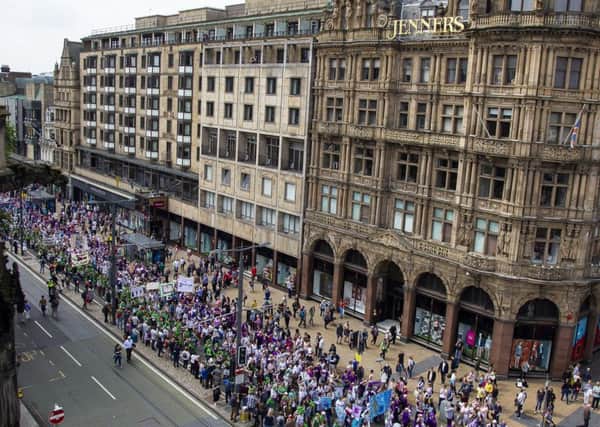 Thousands of people take part in the Suffragette Walk through Edinburgh's city centre. Picture: SWNS