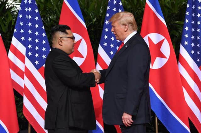 North Korea's Kim Jong-un and US president Donald Trump shake hands at the historic summit in Singapore
