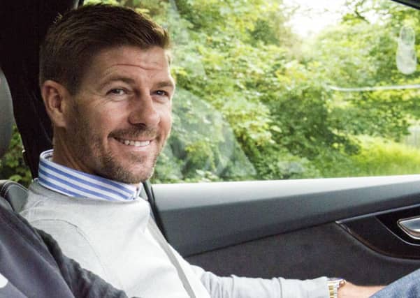 Steven Gerrard is all smiles as he arrives at Auchenhowie. Picture: SNS