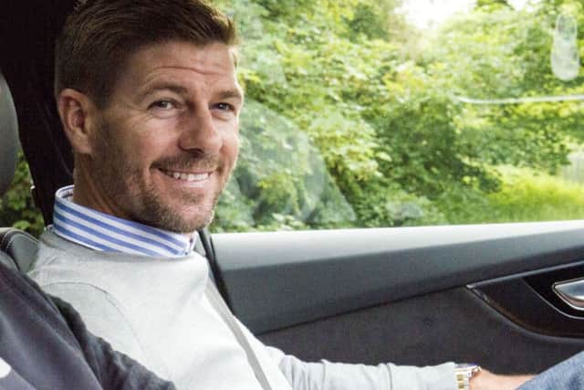 Steven Gerrard is all smiles as he arrives at Auchenhowie. Picture: SNS