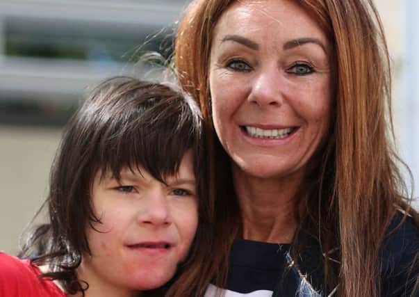 Billy Caldwell with his mother Charlotte, who  has won permission to treat her sons epilepsy with medicinal cannabis. Picture: PA